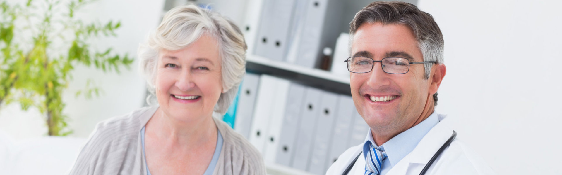 doctor and patient smiling at the camera