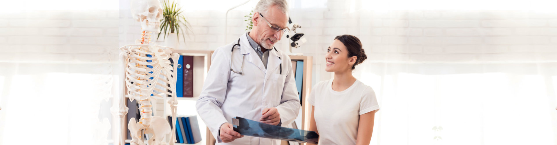 doctor showing x-ray result to woman patient